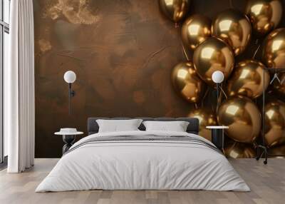 Glossy gold balloons on a textured brown background with a festive vibe Wall mural