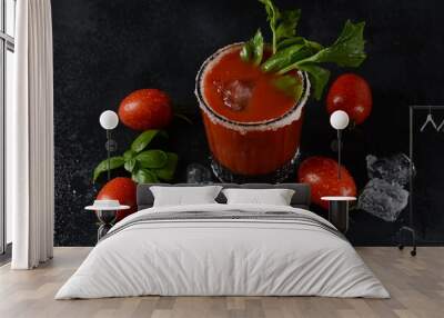 Glass of fresh tomato juice and tomatoes on Dark background with water drops Wall mural