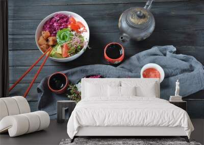 Organic food. Fresh seafood recipe. Two fresh poke bowls with salmon, shrimps, rice, red cabbage, avocado, cherry tomatoes and radish sprouts on wooden background. Food concept Poke Bowl Wall mural