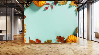 Autumn background creative layout with decorative small pumpkins and autumn leaves Wall mural