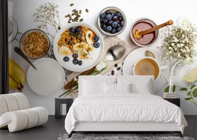 Healthy breakfast set on white background, top view, copy space Wall mural