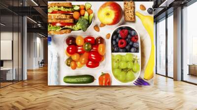 Healthy lunch box with sandwich and fresh vegetables, bottle of water and fruits Wall mural