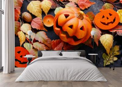 pumpkins with halloween decorations on dark background Wall mural