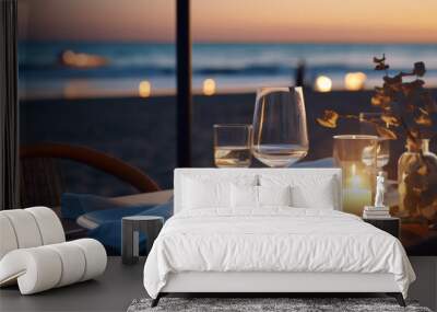 Romantic dinner setting on the beach at sunset Wall mural