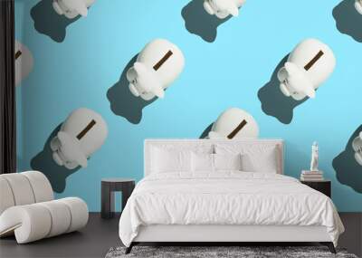 White piggy banks on blue background. Financial and money saving pattern concept banner Wall mural