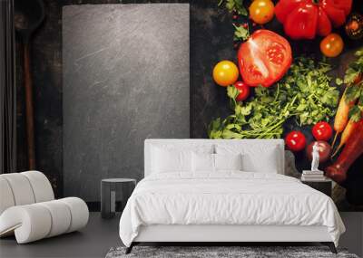 Wooden spoon and ingredients on dark background Wall mural