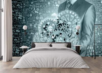 businessman hand touch blue gear to success as concept Wall mural