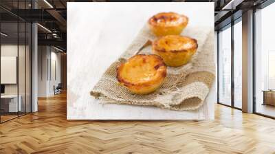 portuguese egg tart pastel de nata on white wooden background Wall mural