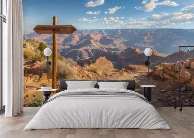 Scenic view of the canyon with a wooden trail signpost in the foreground on a sunny day. Wall mural