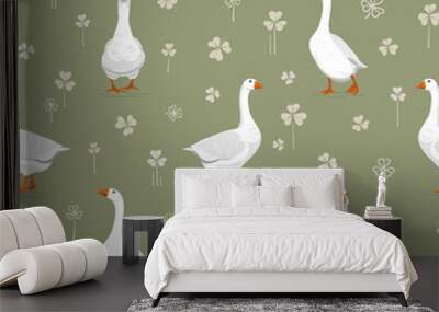 Seamless pattern with white geese among clover leaves. Summer vector illustration Wall mural