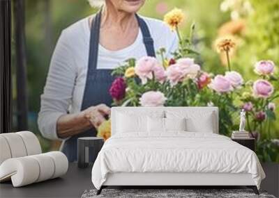 shot of a senior woman holding flowers in her garden Wall mural