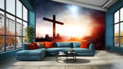 Silhouette of Christian cross on the background of sunset. Easter concept Wall mural