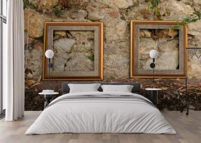 Vintage wooden frames decoration at the stone wall, copy space  Wall mural