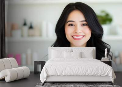 Young woman with long black hair smiling while holding a bottle in a minimalist bathroom setting Wall mural