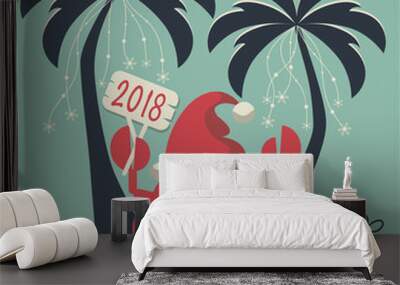 Christmas on the island. Depicts two palm trees, a crab in Santa Claus hat, garlands of snowflakes, presents on the sand , starfish and scarf with the words merry christmas. Wall mural