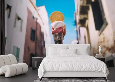 Delicious gelato or ice cream in waffle cone in Venice Italy. Wall mural