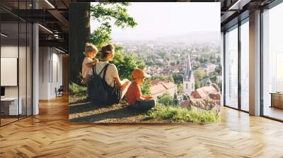 Family outdoors on background of Ljubljana, Slovenia, Europe. Wall mural