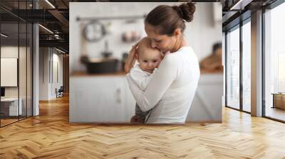 mom holds her son in her arms,comforts him Wall mural