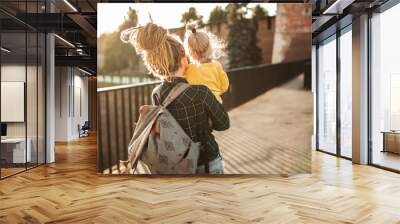 mom with dreadlocks hipster and toddler walk Wall mural