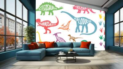 Set of colorful isolated dinosaurs with lettering and footprints. Vector illustration. Wall mural