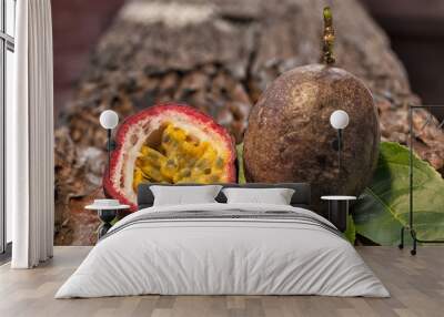 Whole and cutted fresh passion fruit on rustic vintage wooden ta Wall mural