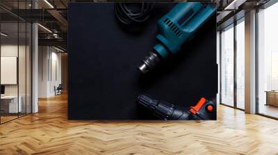 Construction worker tools on a dark background top view. Wall mural