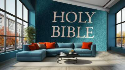 Holy Bible title closeup in sunlight. Religion and faith concept. Religious literature. Bible isolated. Christianity background. Vintage Bible book in light. Wall mural