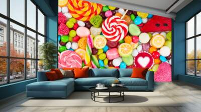 Colorful lollipops and different colored round candy. Wall mural