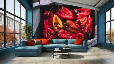 Roasted red and yellow peppers in baking tray. Wall mural