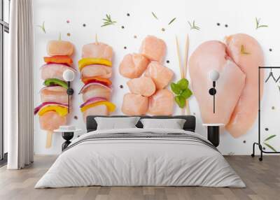 Uncooked meat skewer with peppers.Chicken Skewers breast fillet meat.Skewers with pieces of raw meat,red,yellow pepper.Top view.Raw chicken skewers with vegetables, peppers,onions,white background. Wall mural