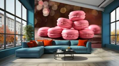 very juicy pink macarons stack on the table behind mini light bulbs yellow light Wall mural