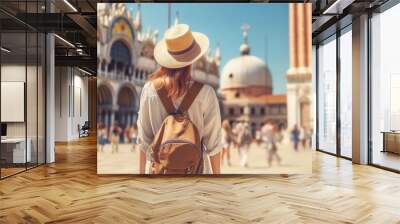 Young girl with backpack in hat stands with her back in St. Marks Square and looks at the Doges Palace. Generative AI content. Wall mural