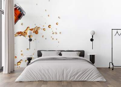 A bottle of beer, creating a splash of liquid. Concept of excitement and enjoyment, as the beer is being poured into the glass, ready to be consumed. porter beer splash from bottle on white background Wall mural