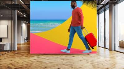 A man is walking on a beach with a red suitcase. Concept of adventure and excitement, as the man is preparing for a trip. The bright colors of the beach and the suitcase create a cheerful Wall mural