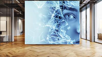 A woman's face is shown in a blue background. The image has a futuristic and abstract feel to it, with the woman's face being focus. young woman with face, composed of shattered neuronal network Wall mural