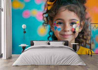 Artist painting face of little girl indoors. little girl having her face painted for kids party. carnival family lifestyle Face painting, headshot close up. A happy little girl painted with colorful  Wall mural