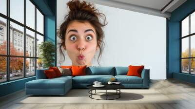 girl grimacing. WTF! Head shot portrait of shocked frustrated woman. portrait of young woman grimacing. Young brunette woman standing over white background puffing cheeks with funny face. mouth inflat Wall mural