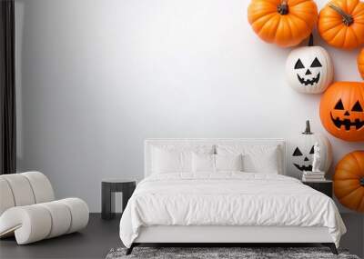 White background with a row of pumpkins on it. The pumpkins are orange and white, and they are arranged in a row. Some of the pumpkins have black faces, while others have white faces Wall mural