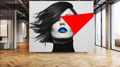 woman's face set against a minimalist gray background. image in black and white, except for two vivid color accents: a bold red triangular shape over her right eye, deep blue lipstick on her lips Wall mural