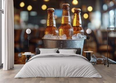 cold bottles of beer in bucket with ice in a restaurant setting Wall mural