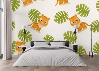 Tiger cub and tropical leaves. Wall mural