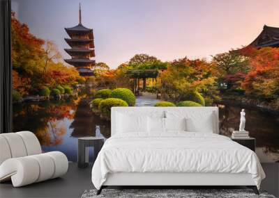 Ancient wooden pagoda Toji temple in autumn garden, Kyoto, Japan. Wall mural