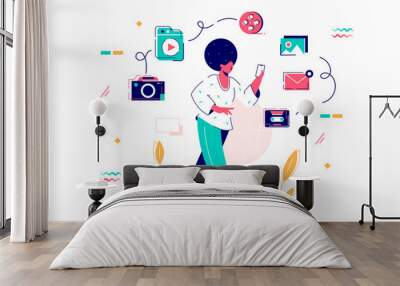 Young african american woman with afro hairstyle and smartphone. Wall mural