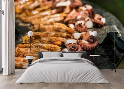 Cooking shrimp, octopus and sausage on a large grill Wall mural