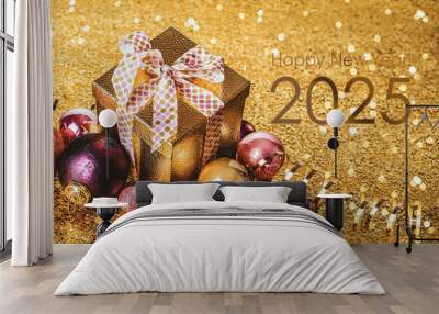 Happy New Year! Gift in a golden box with a bow and Christmas balls on a golden background Wall mural