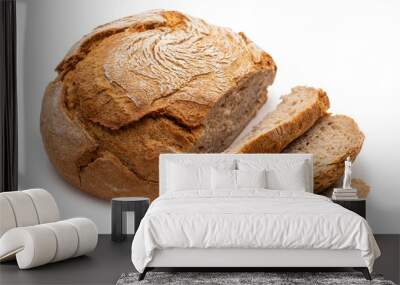 Round peasant bread with cut pieces. Isolate on white background  Wall mural