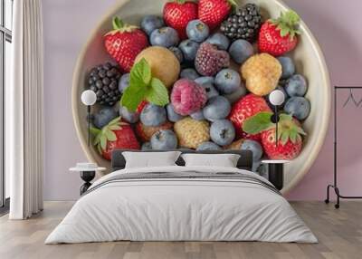 assortment of berries in a beautiful bowl Wall mural