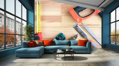 Construction tools on wooden background. Wall mural