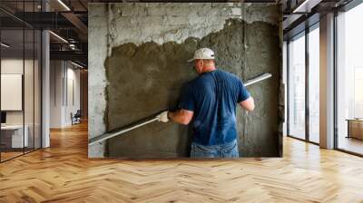 Construction worker plastering wall with leveler. Wall mural