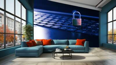 Cybersecurity concept, padlock on laptop computer keyboard Wall mural